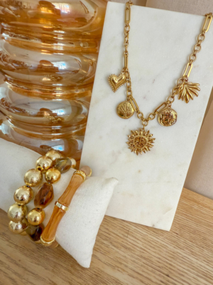 Collier 5 breloques fleur centrale